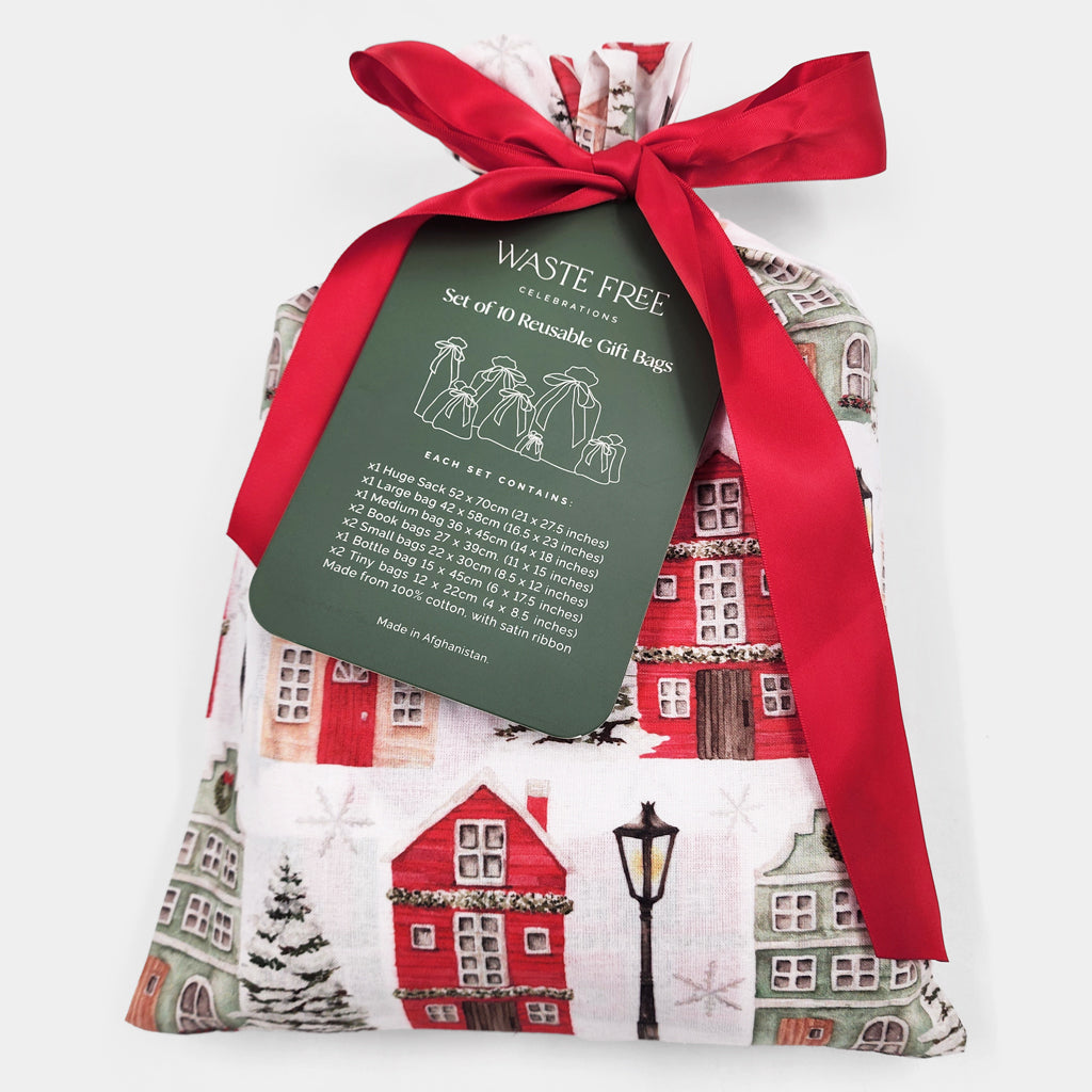Set of 10 reusable gift bags, including a huge santa sack. Red and white Christmas cottages design.