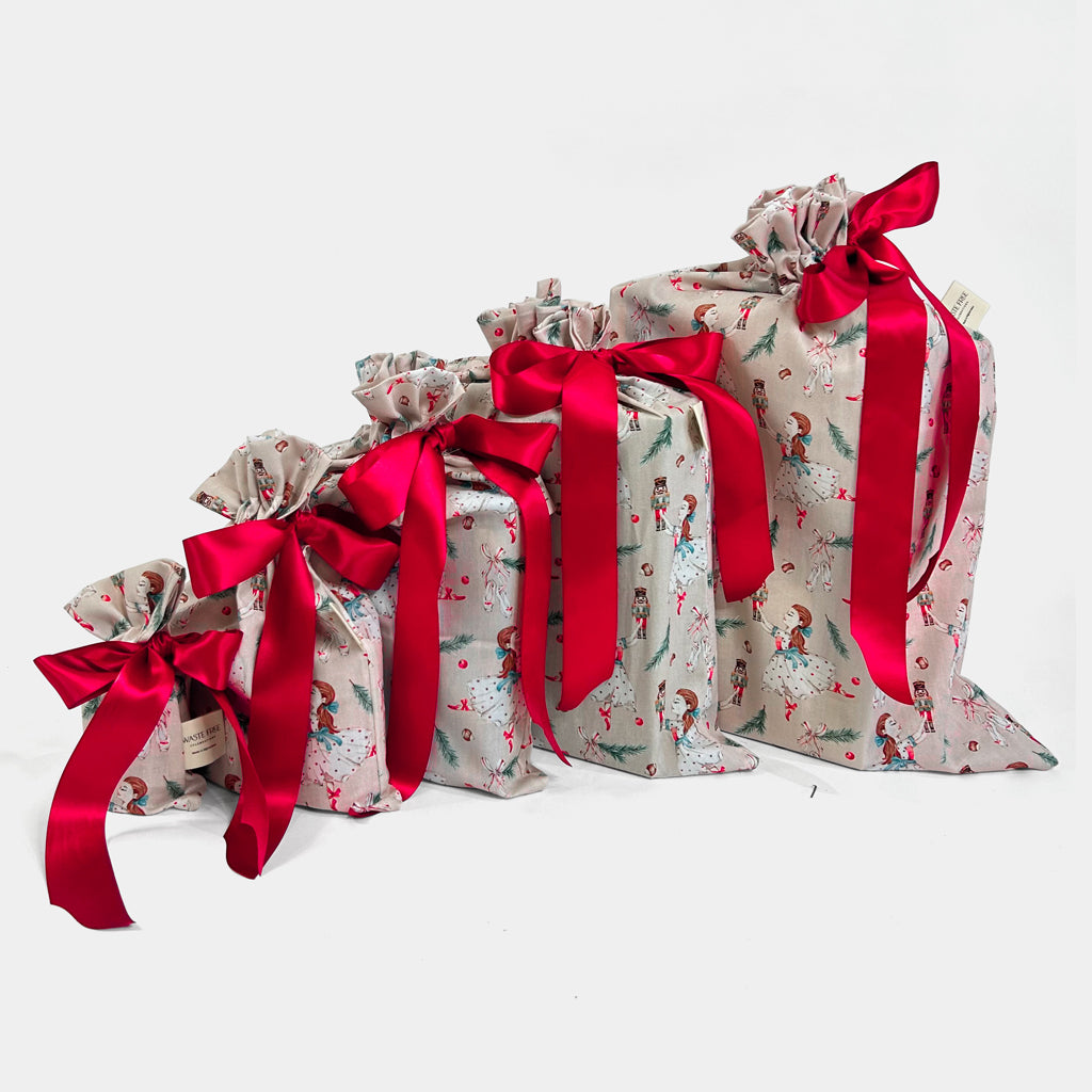 Set of 5 reusable gift bags in a hand-painted design featuring Clara dancing with the Nutcracker.