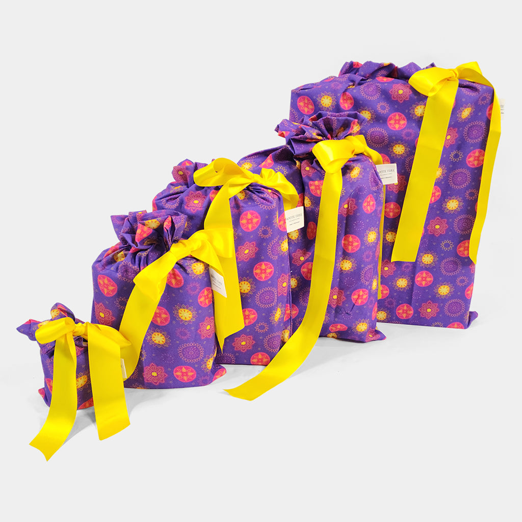 Set of 5 reusable gift bags in a vibrant purple and hot pink mandala design with a bright yellow bow suitable for Diwali