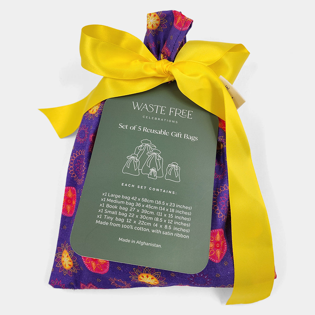 Set of 5 reusable gift bags in a vibrant purple and hot pink mandala design with a bright yellow bow suitable for Diwali