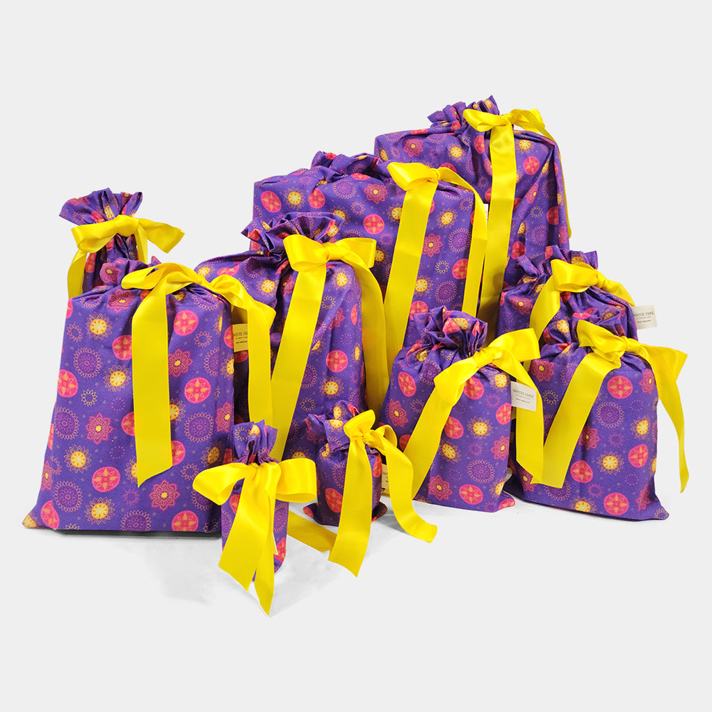 Set of 10 reusable gift bags including a huge santa sack in a vibrant purple and hot pink mandala design with a bright yellow bow suitable for Diwali
