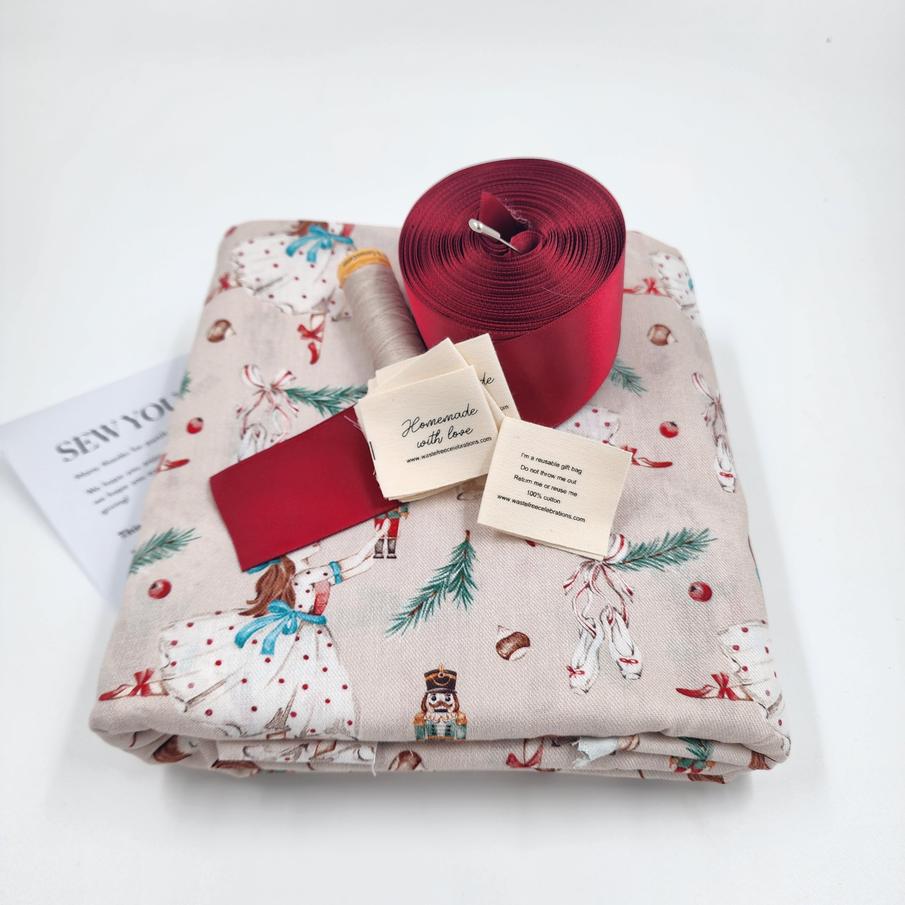 Set of 10 reusable gift bags including a huge santa sack. In a hand-painted design featuring Clara dancing with the Nutcracker.