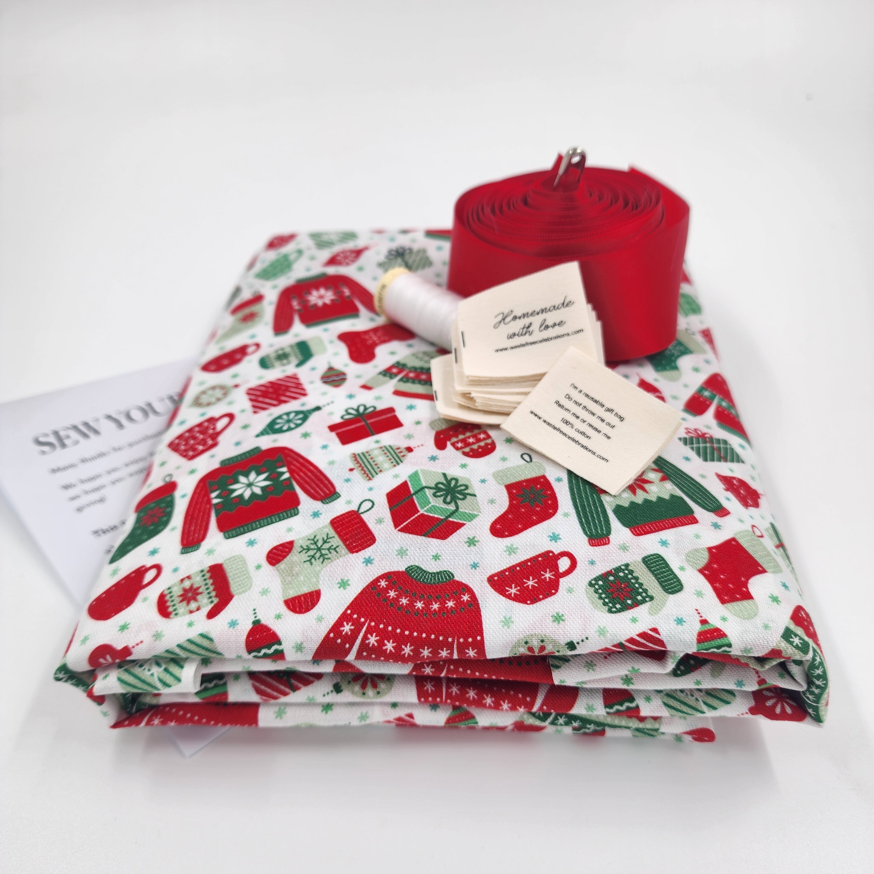 Set of 10 reusable gift bags includes large Santa sack. Scandi Ugly Sweater design.