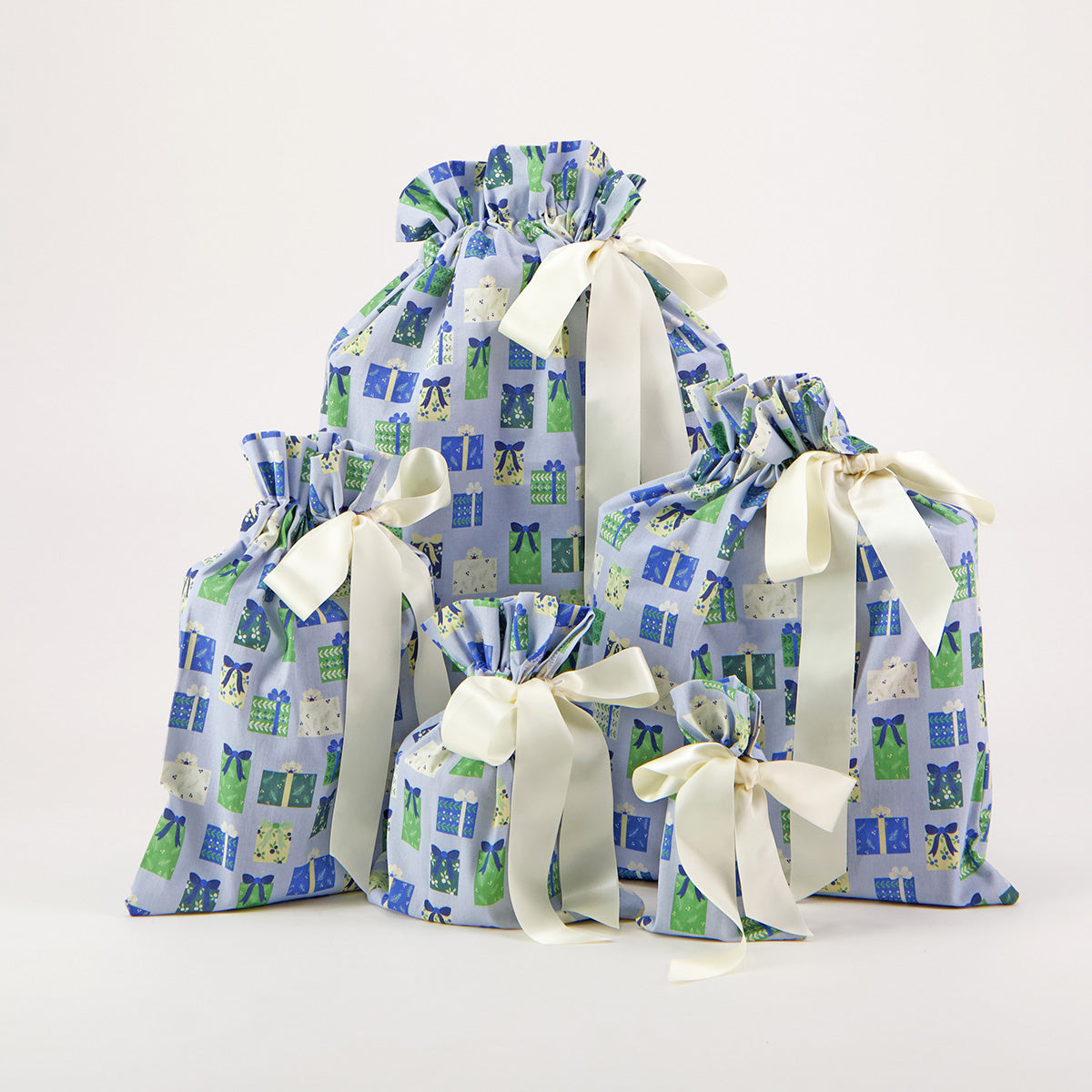 Folk Gaver reusable gift bag set of 5 — illustrated gift box print in soft blue, sage and cream — handmade in Afghanistan