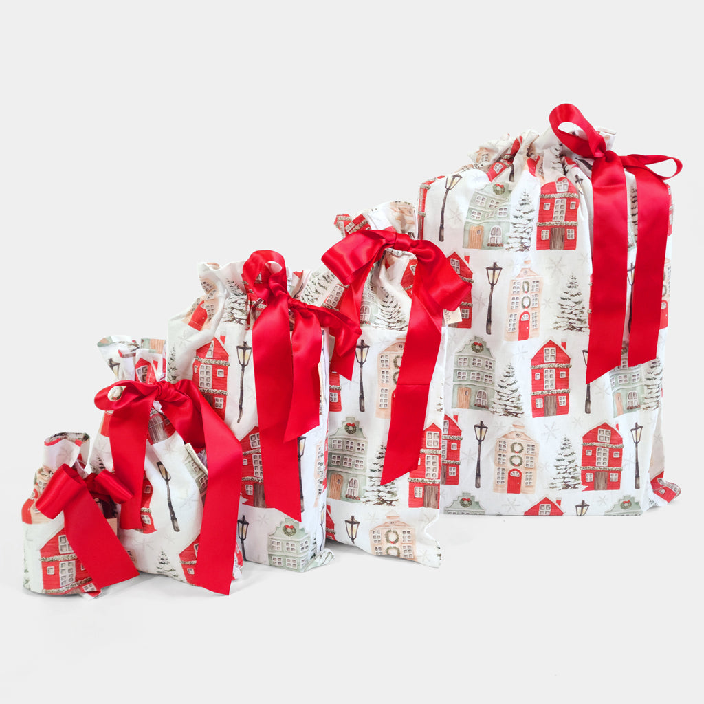 Set of 5 reusable gift bags. Red and white Christmas cottages design. 
