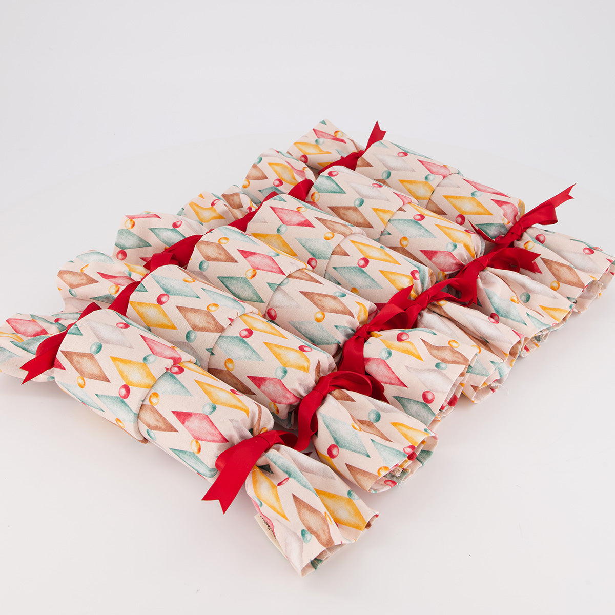 Harlekin reusable Christmas crackers — playful harlequin print in soft multicolour — handmade in Afghanistan