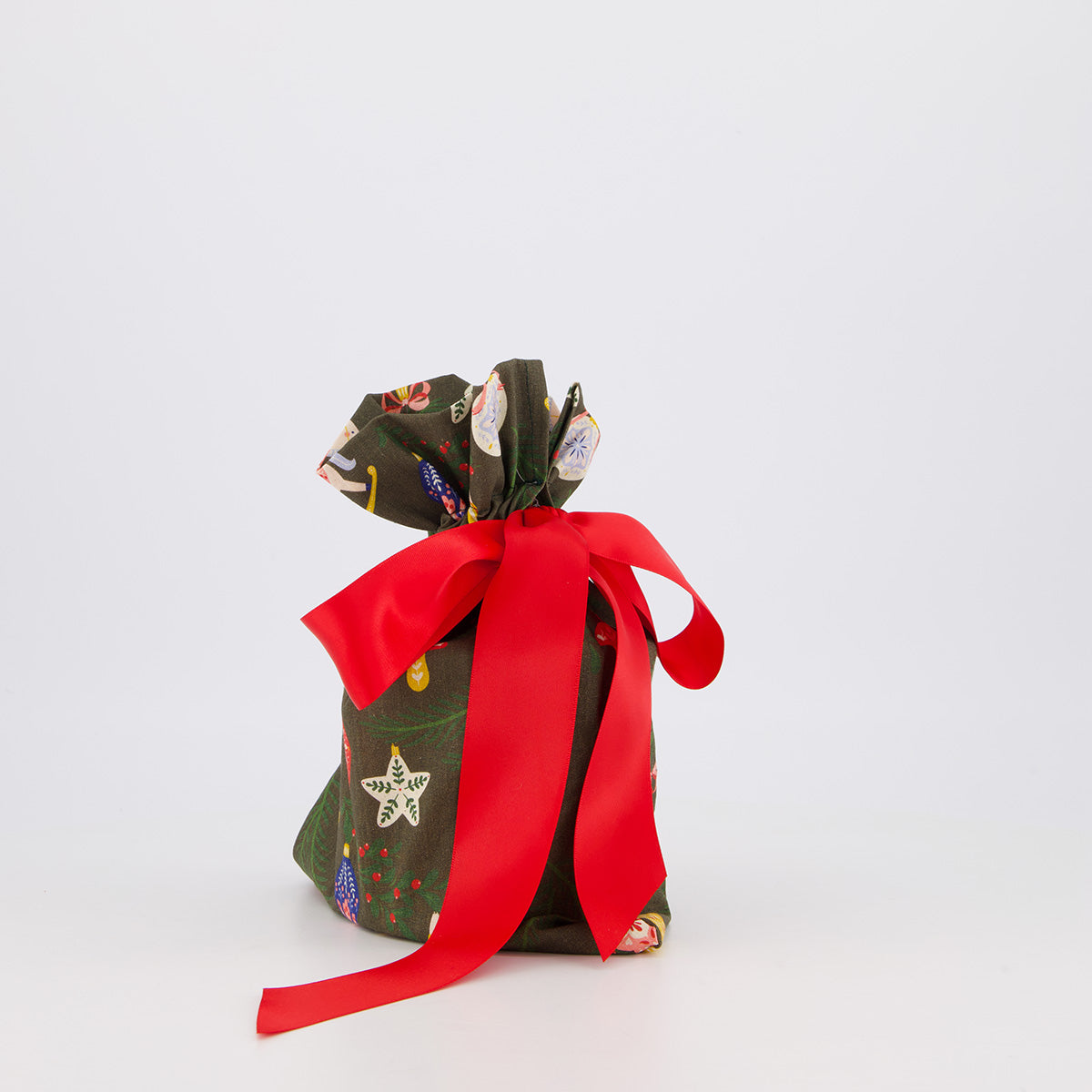 Small reusable gift bag — bold folk print in green, red and navy — handmade in Afghanistan