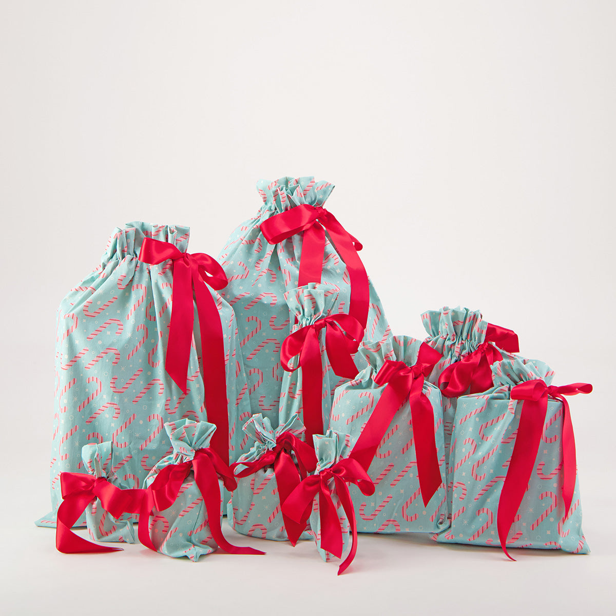 Dulces reusable gift bag set of 10 — candy cane print in pink and white on mint green — handmade in Afghanistan