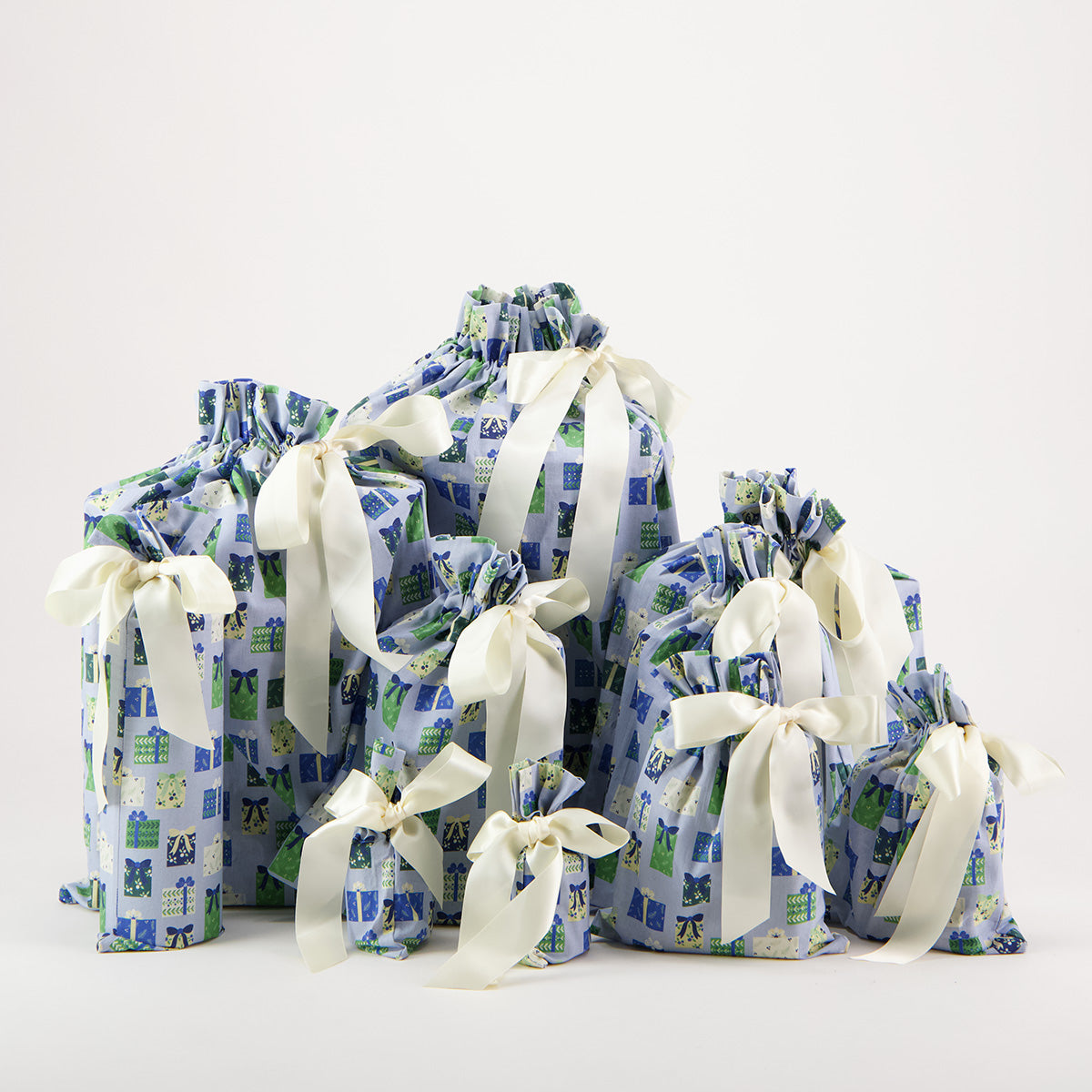 Folk Gaver reusable gift bag set of 10 — illustrated gift box print in soft blue, sage and cream — handmade in Afghanistan
